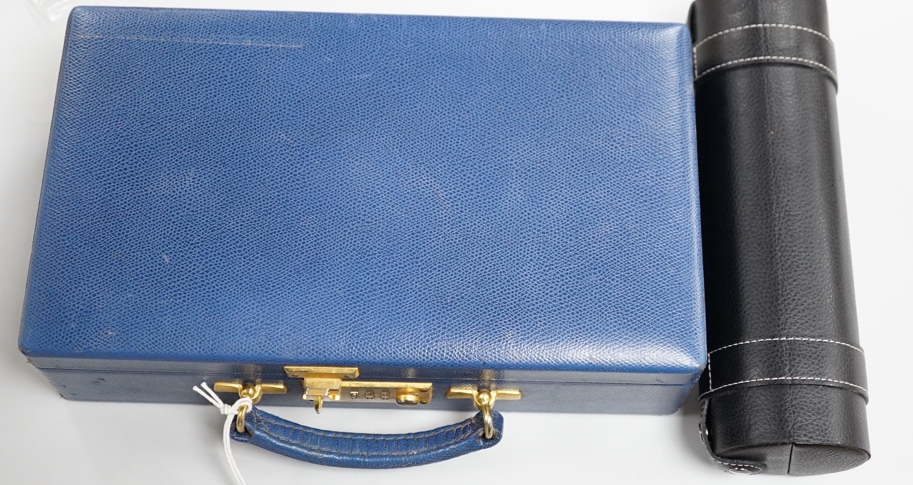 A cased novelty cocktail set and a Fortnum & Mason fitted leather case - combination lock 0000, 31cms wide x 18cms deep
